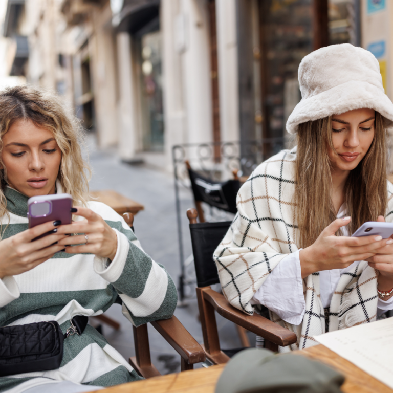 Photo of young women scrolling online